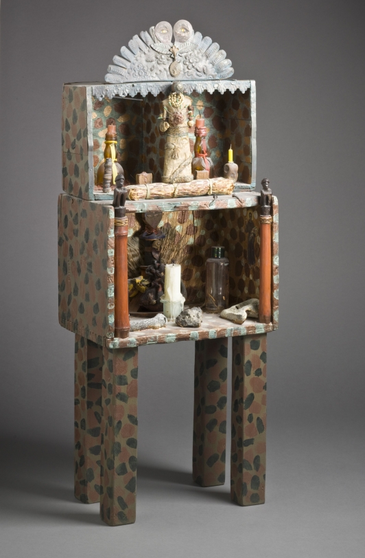 Betye Saar Gris Gris Guardian, 1990-93 Wood, wire, glass, candles, braided rope, stones, nails, oil paint, feathers, beads, steel, bronze, corn husks, and petrified wood 28 x 11 x 7.5 in (71.12 x 27.94 x 19.05 cm) Collection of the Los Angeles County Museum of Art; purchased with funds provided by the Richard Florsheim Art Fund and the Modern and Contemporary Art Council